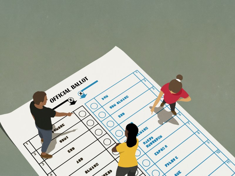 People talking and pointing on voting ballot