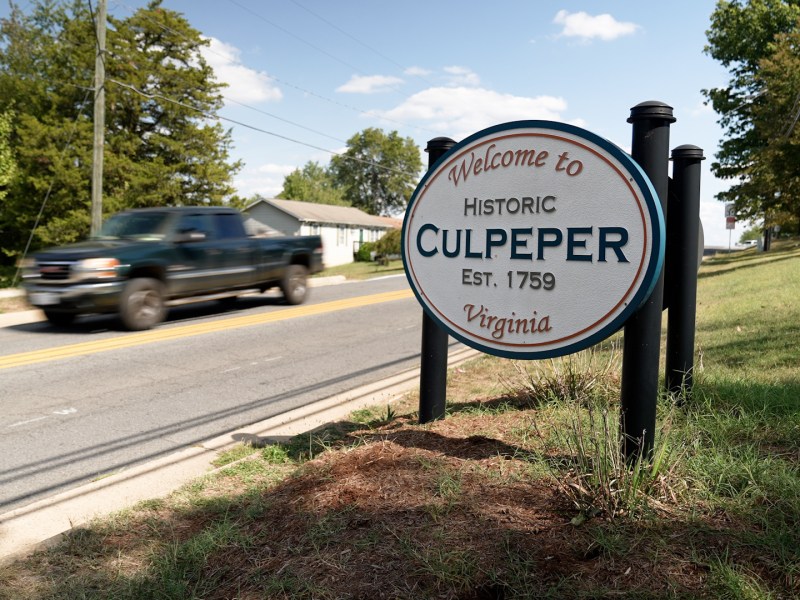 A sign for Culpeper, Virginia, is displayed on a road.